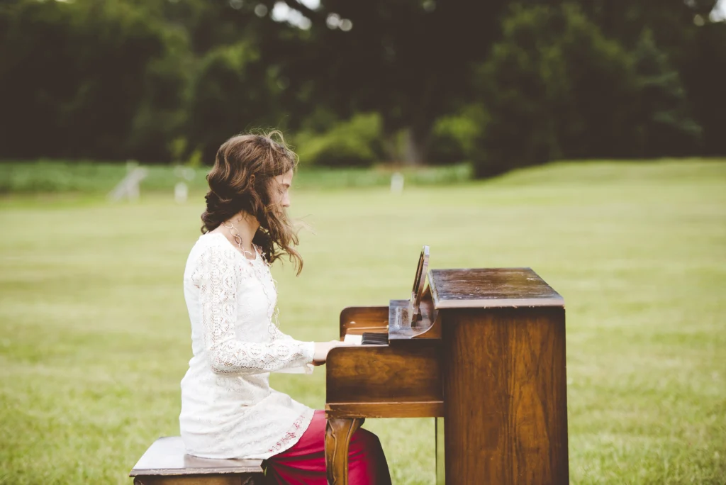 Young pianist playing the coolest song on piano with joy and focus