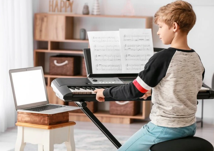 Beginner playing Disney piano sheet music with easy notes