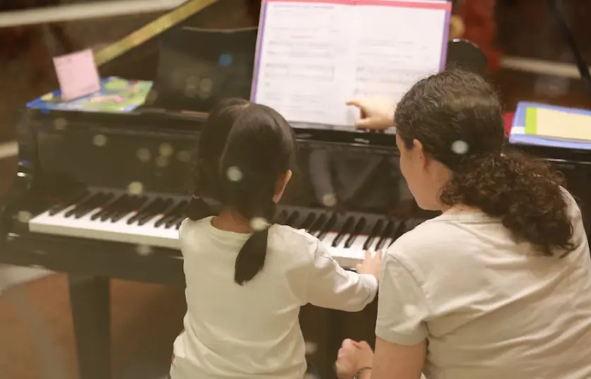 Young family using MuseScore to learn music together