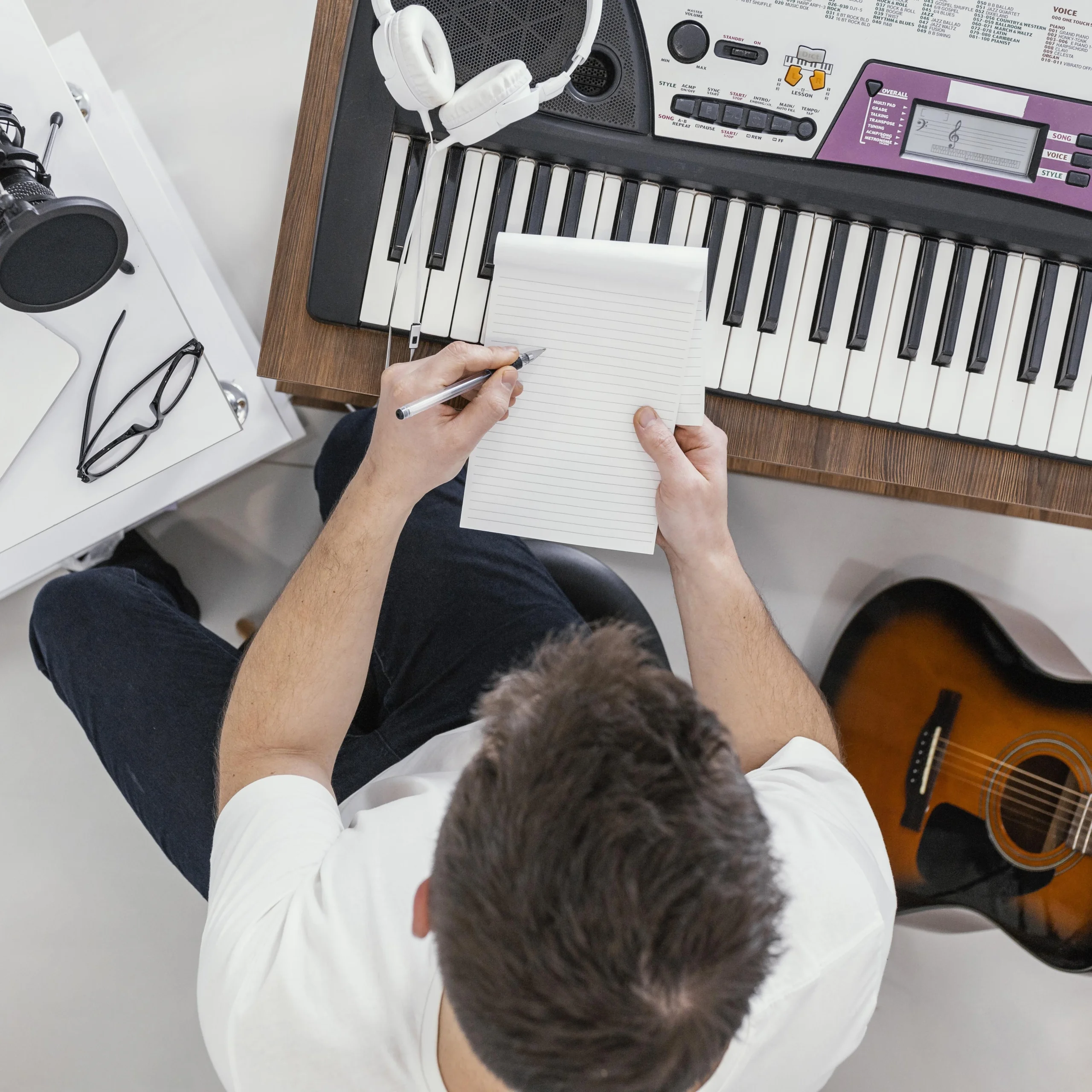 Beginner pianist practicing popular pop piano sheet music with simplified arrangements on a keyboard.