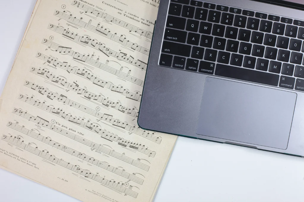 Family printing sheet music together at home computer