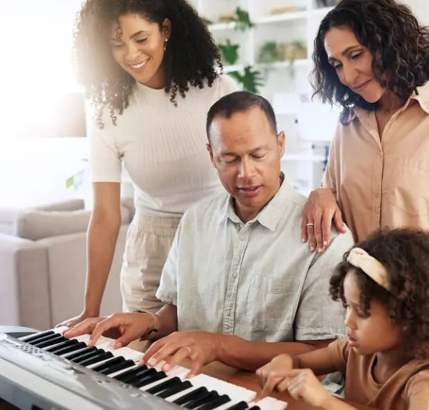 Family using Simply Piano app together at home on a digital keyboard